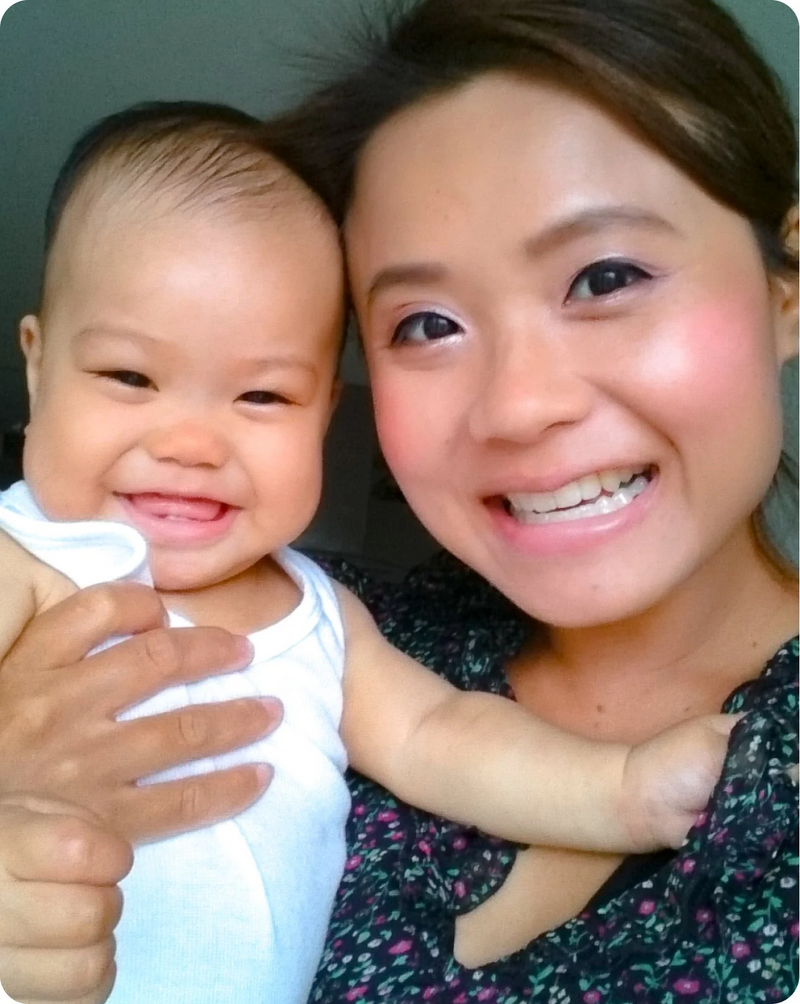 Smiling mum holding her happy baby, from the Silverette personal story