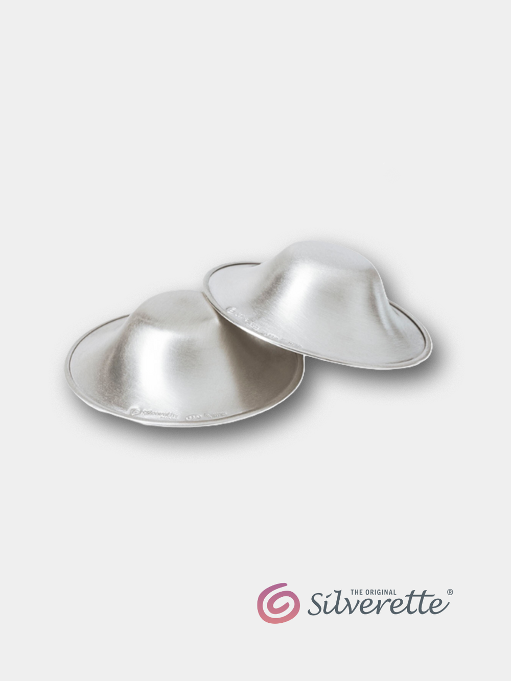Pair of Silverette nursing cups made from 925 sterling silver, shown on a light grey background