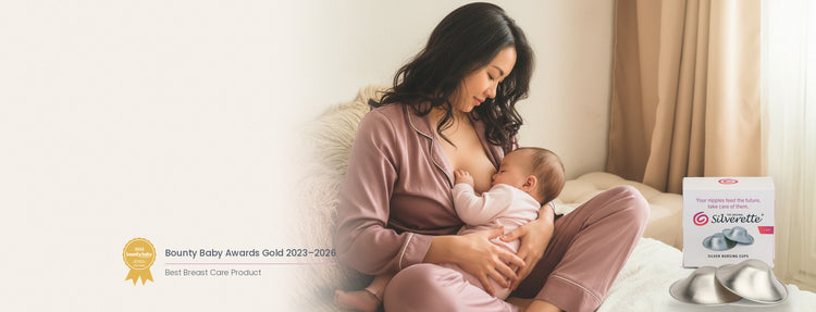 Mother breastfeeding her baby beside a box of Silverette 925 sterling silver nursing cups, with the Bounty Baby Awards Gold badge